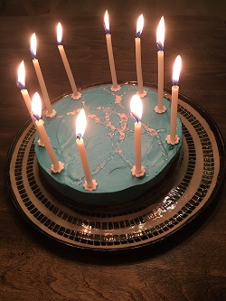 Photo of birthday cake displaying HRI logo.